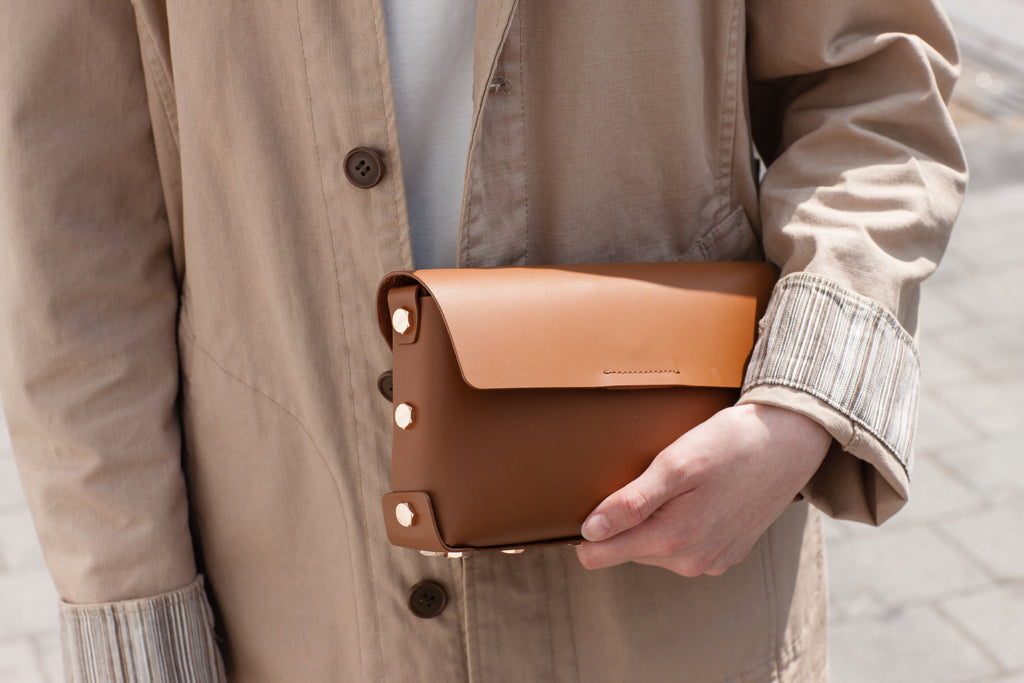 From basic jeans to work attire the Asmbly Clutch with carry you through.