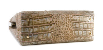 Gold feet on the bottom of the Vanessa ladies two-tone textured leather bag